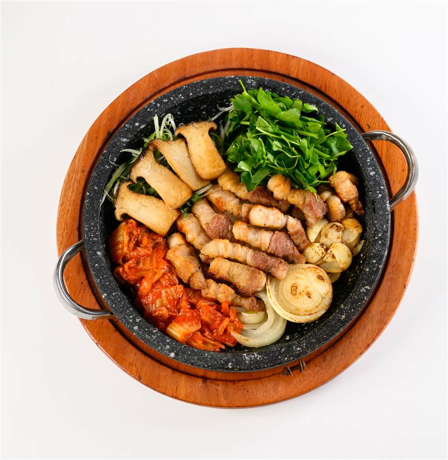 Korean pork belly and kimchi stone pan on a white background, Ye Won Resto